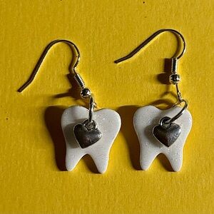Heart charmed tooth dangles